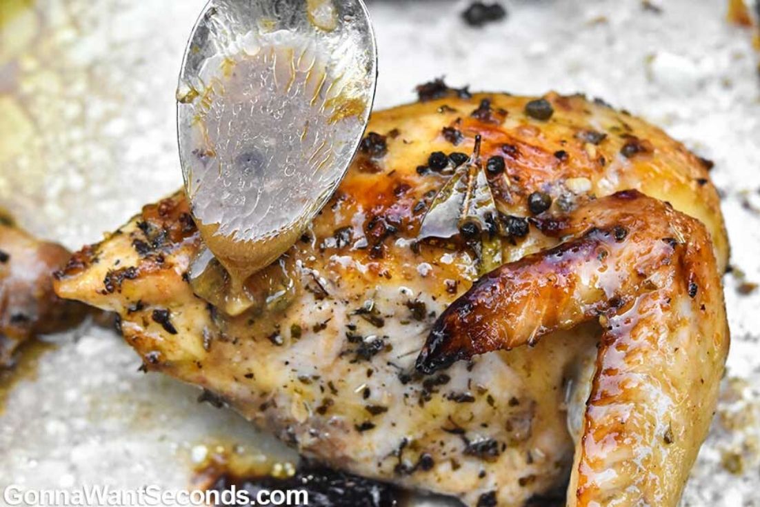 How to make Chicken Marbella, drizzling sauce over chicken