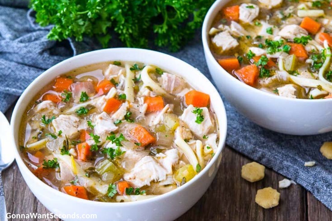 Two Chicken Noodle Soup in white bowls