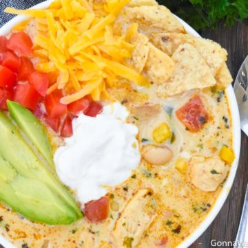 Instant pot white chicken chili in a bowl, with toppings