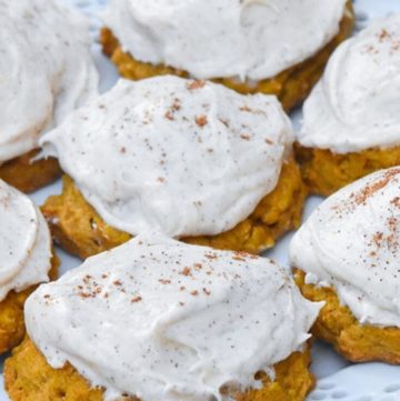 Pumpkin oatmeal cookies with cream cheese frosting, on a plate