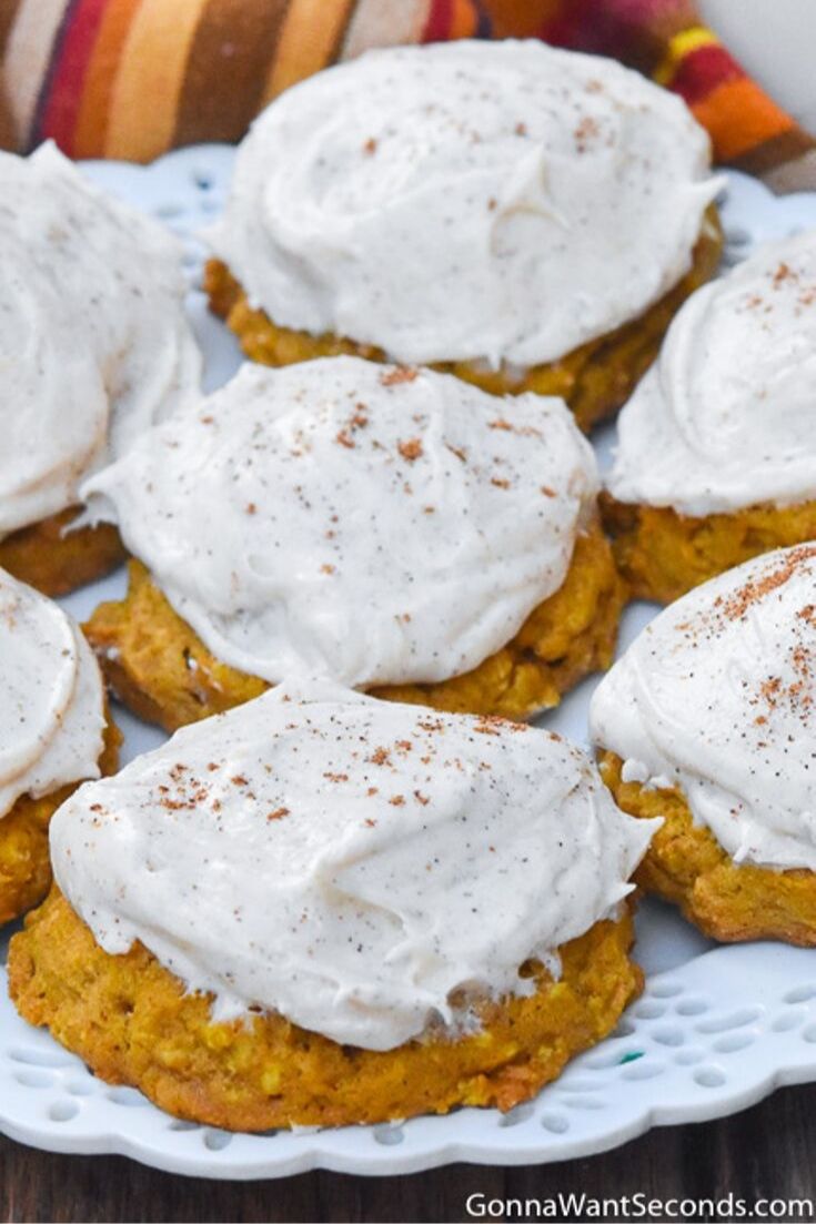 Pumpkin oatmeal cookies with cream cheese frosting, on a plate