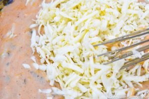Step 2 How to make creamy chicken spaghetti casserole, mixing cheese in sauce