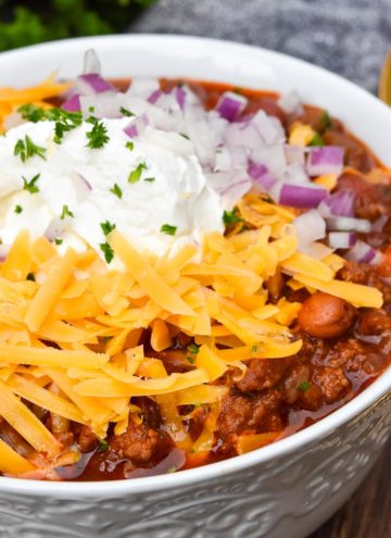 instant pot chili with toppings, in a white bowl
