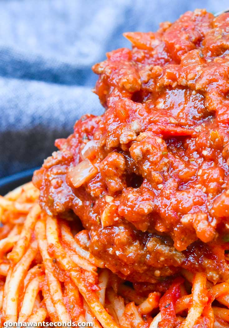 Spaghetti Sauce poured over spaghetti pasta