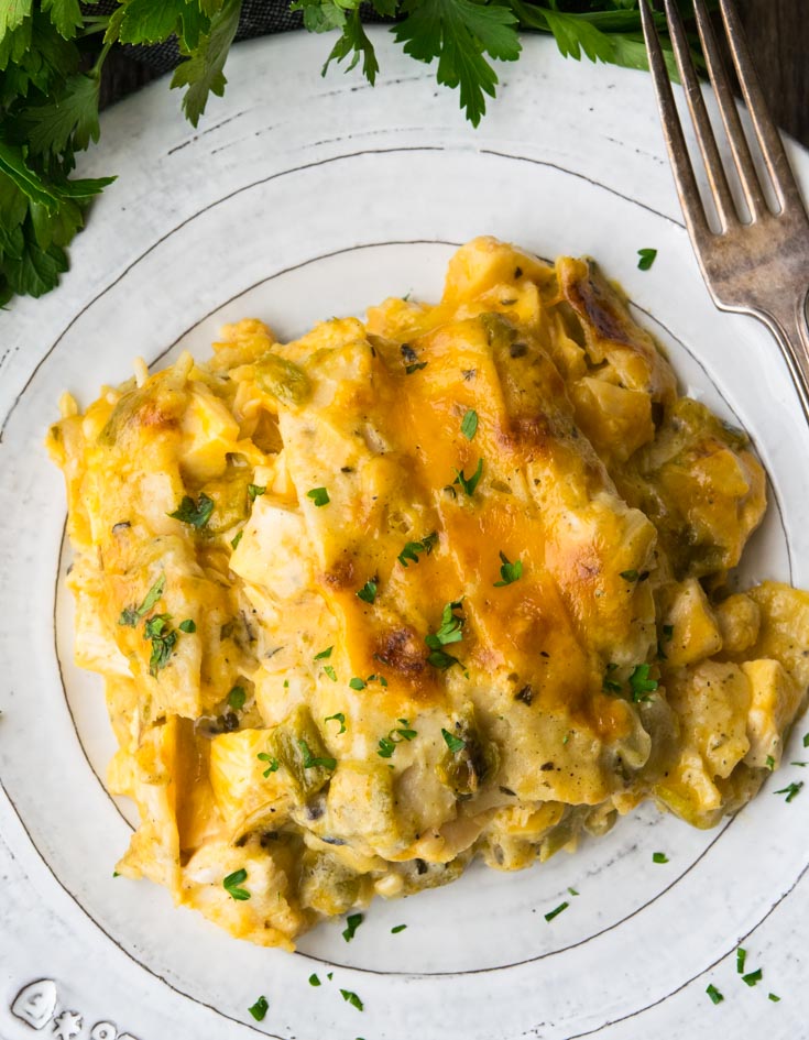 Chicken Tortilla Casserole on a plate with fork on the side.