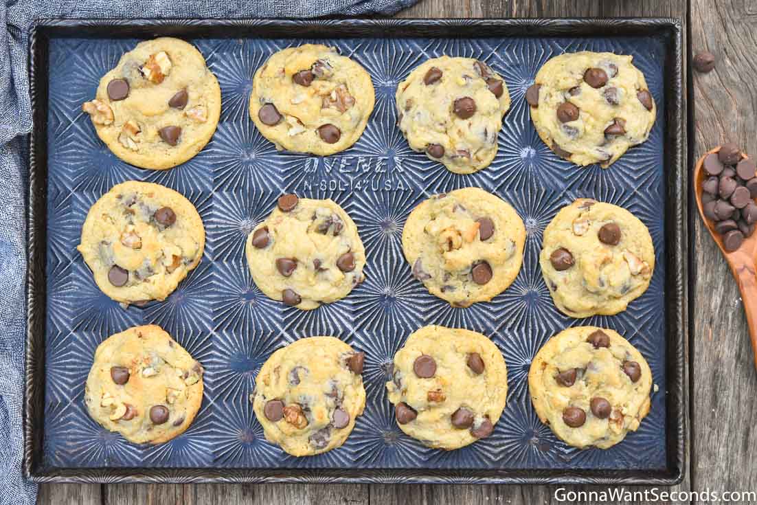thick chocolate chip cookies with vanilla pudding on baking sheet