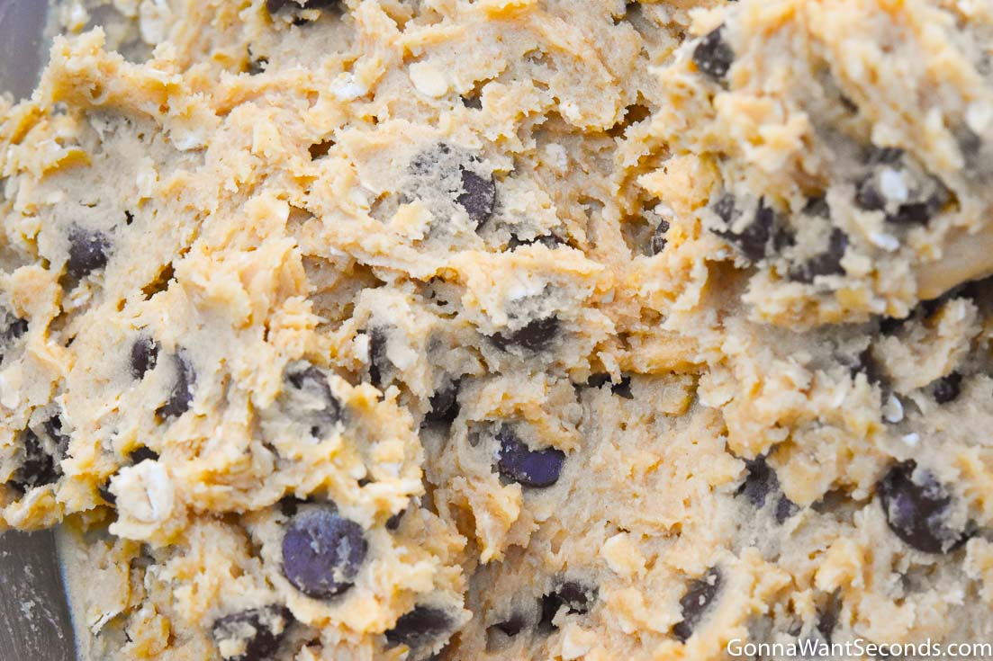 How to make Peanut butter oatmeal chocolate chip cookies, mixing the dough