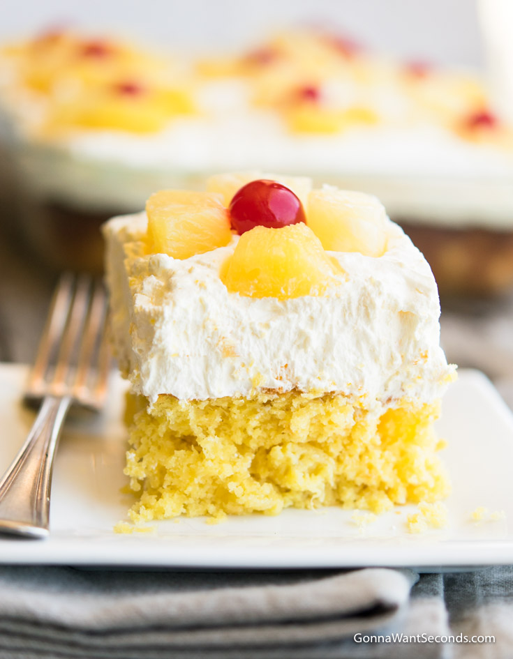 Memorial Day Recipes, A slice of Pineapple Sunshine Cake with whipped topping
