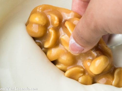 How to make Polar Bear Paws Candy, dipping caramel in white chocolate