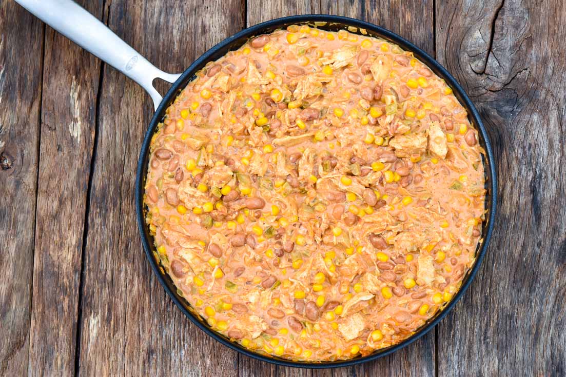 How to make Mexican chicken casserole, mixing ingredients in pan