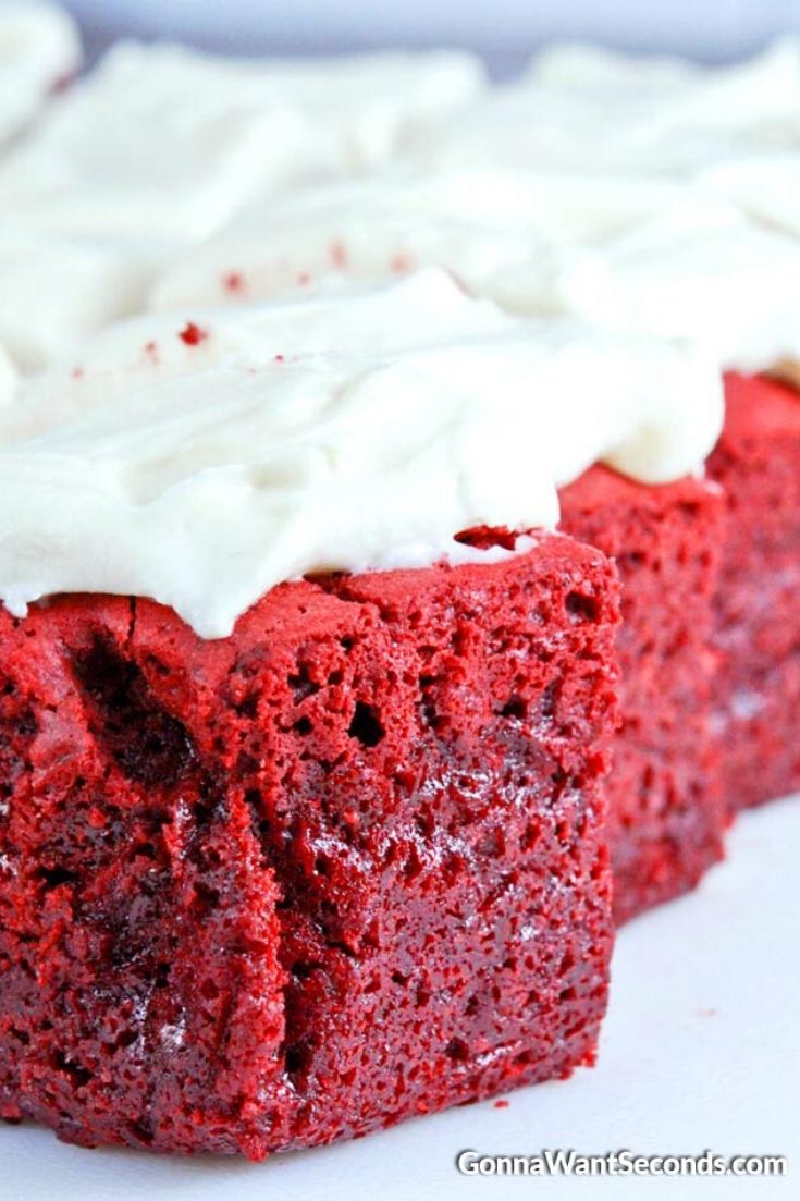 Slices of red velvet brownies with cream cheese frosting