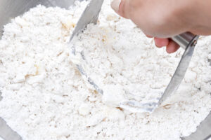 Step 3 how to make Bisquick rolled biscuit, Using a pastry blender or 2 knives, cut in butter.