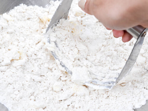 Step 3 how to make Bisquick rolled biscuit, Using a pastry blender or 2 knives, cut in butter.