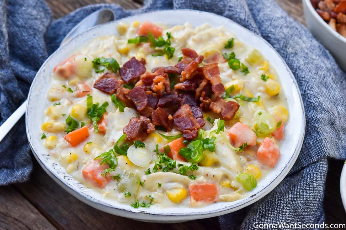 Chicken corn chowder topped with bacon bits in a bowl