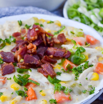 Chicken corn chowder topped with bacon bits in a bowl