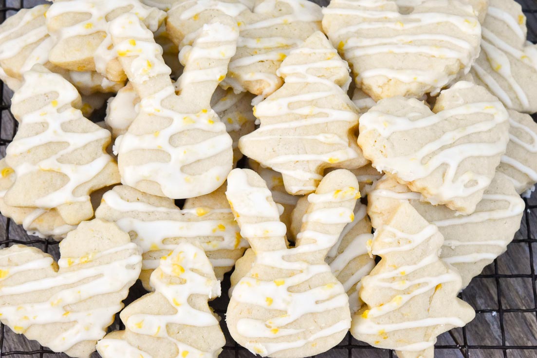 A pile Lemon Sugar Cookies on a cooling sheet