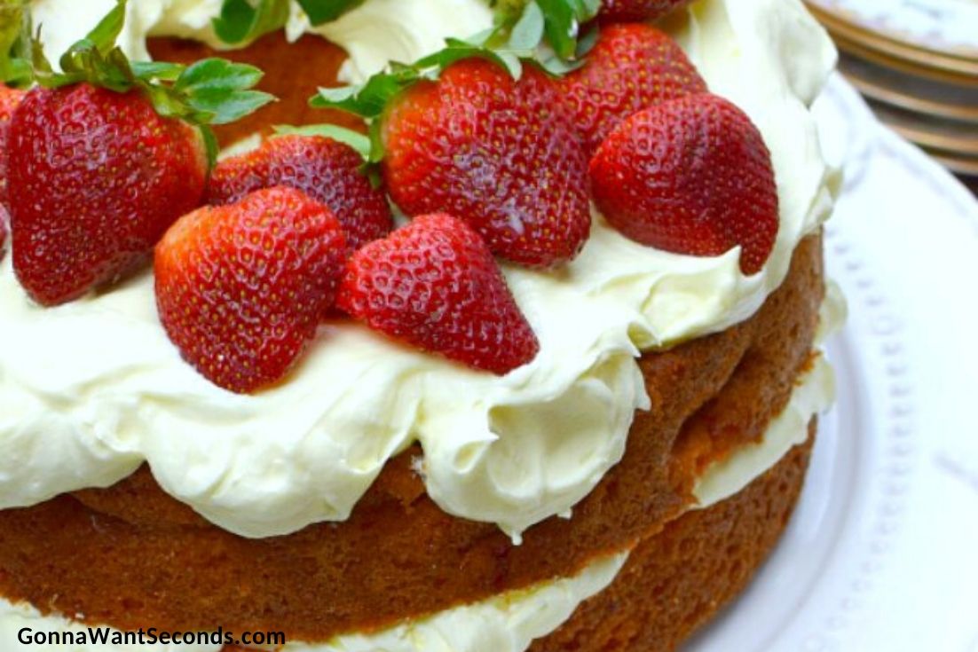 Whole Strawberry Cream Cake topped with fresh strawberries