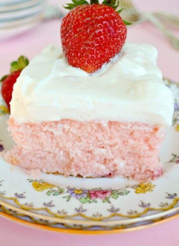A slice of Strawberry sheet cake on a plate