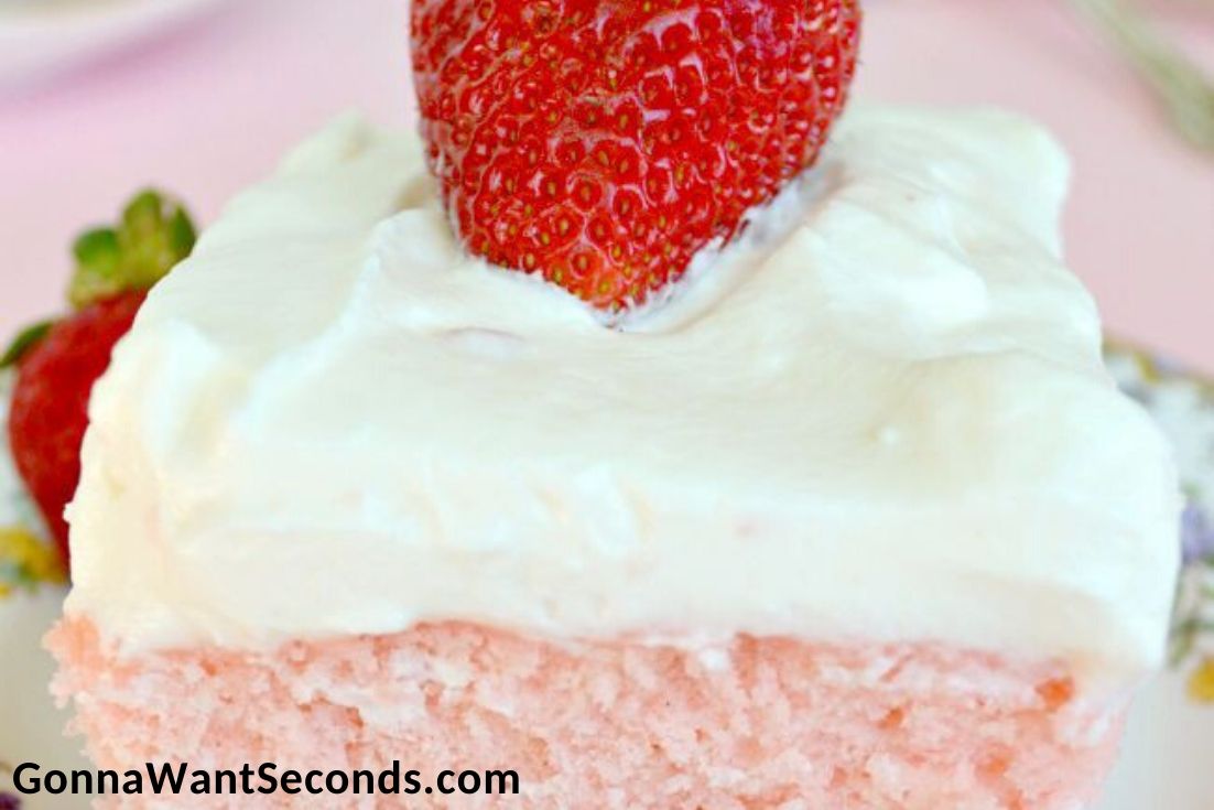A slice of Strawberry sheet cake on a plate