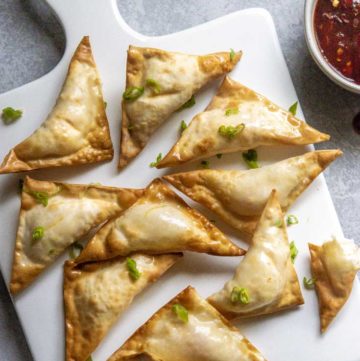 air fryer crab rangoon on a plate with dipping sauce