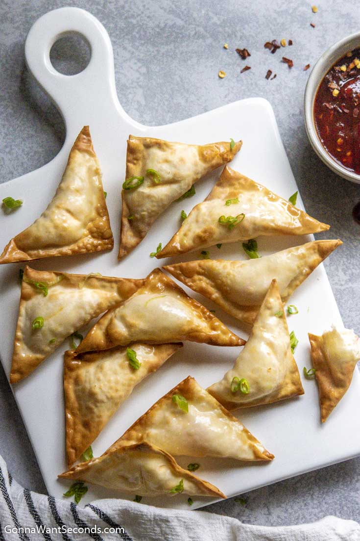 air fryer crab rangoon on a plate with dipping sauce