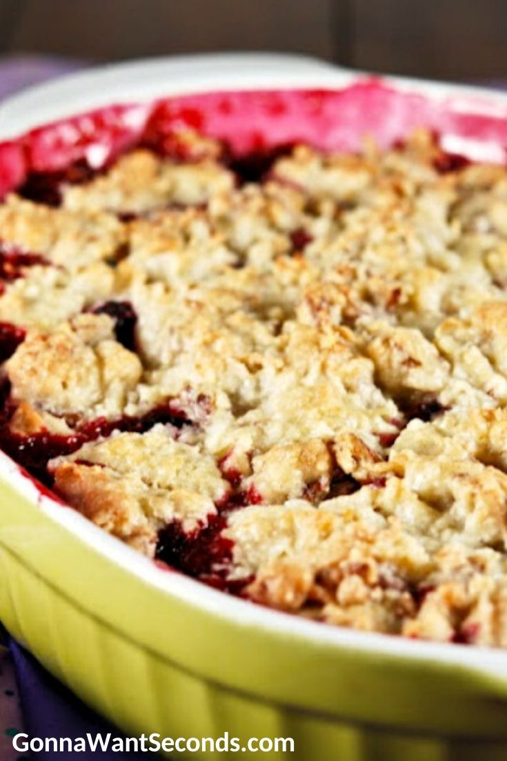 blackberry cobbler with a pecan cookie topping in a casserole dish
