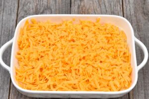 Step 5 how to make Baked Pineapple Casserole, Sprinkle cheese evenly over top.