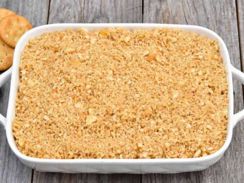 Step 6 how to make Pineapple Ritz Casserole, Sprinkle the crushed cracker and butter mixture over the cheese. Bake.