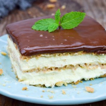 A slice of eclair cake on a blue saucer