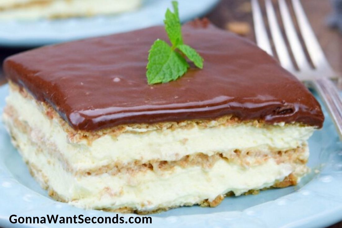 A slice of eclair cake on a blue saucer