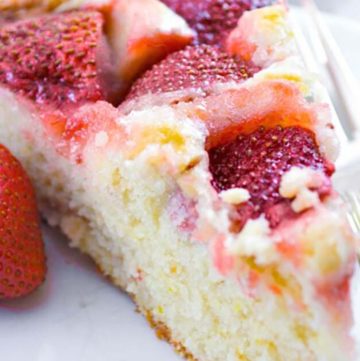 A slice of strawberry cake on a plate