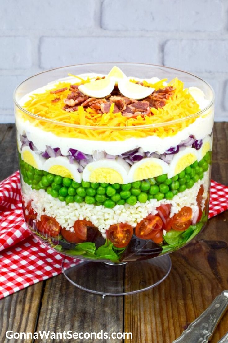7 layer salad in a glass bowl