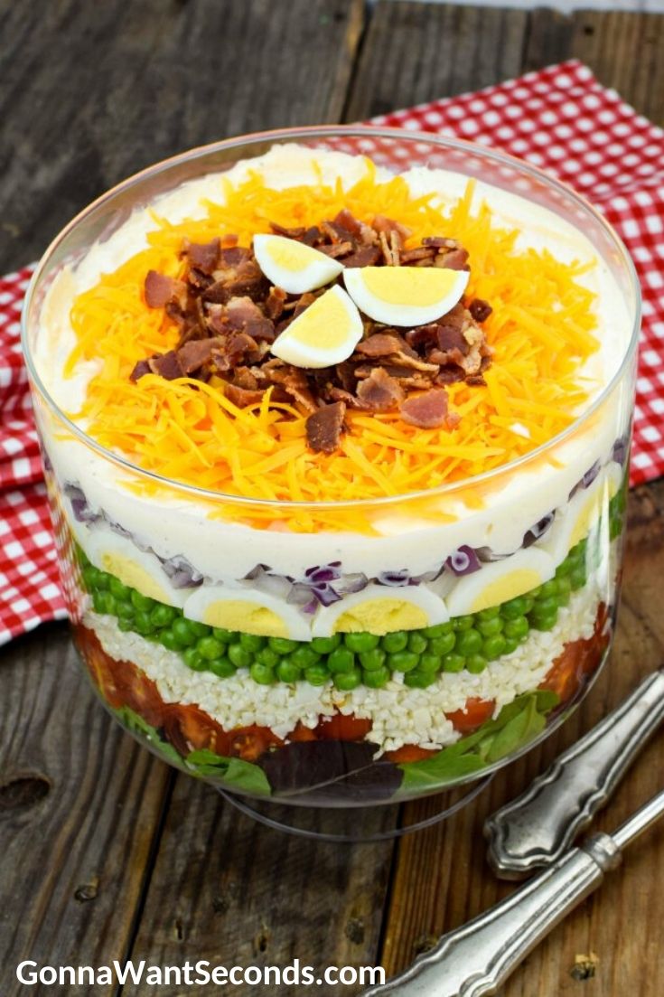 7 layer salad in a glass bowl