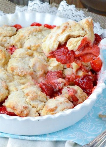 Scooping a portion of Strawberry Cobbler