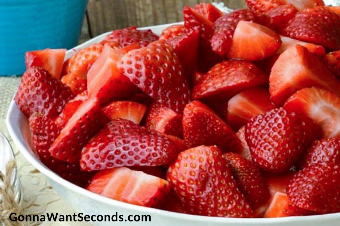Strawberry Cobbler, quartered fresh strawberries in a bowl