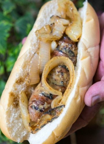 beer brats topped with caramelized onions