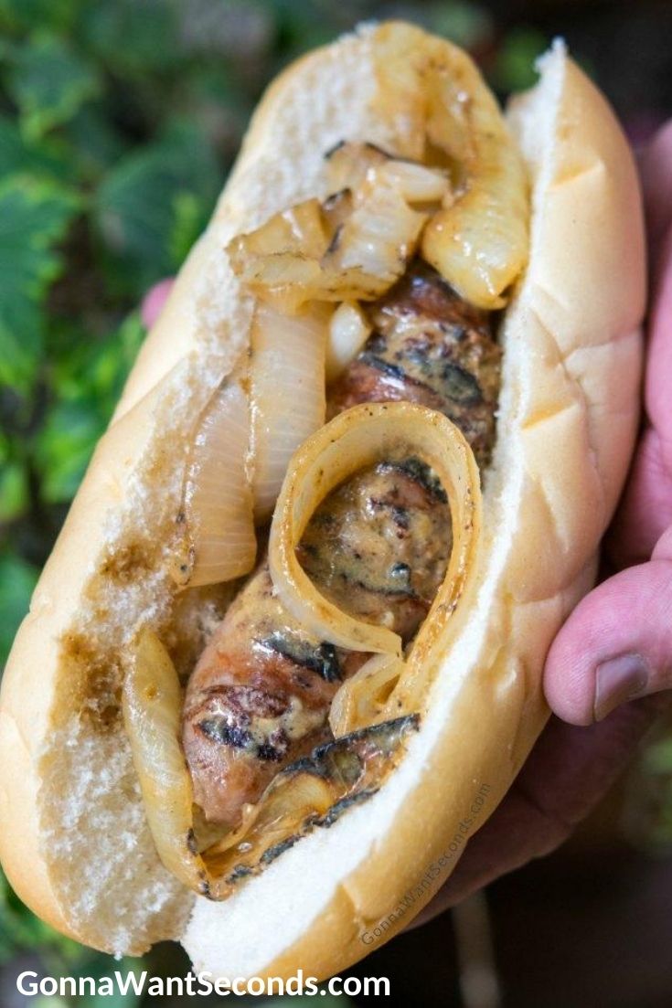 beer brats topped with caramelized onions
