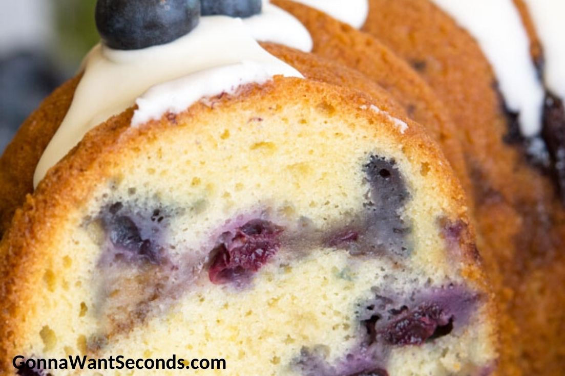 Whole Blueberry Coffee Cake cut in half showing blueberries inside