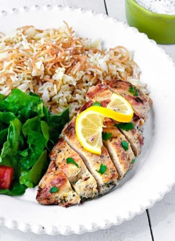 Greek Chicken with rice and lettuce on the side