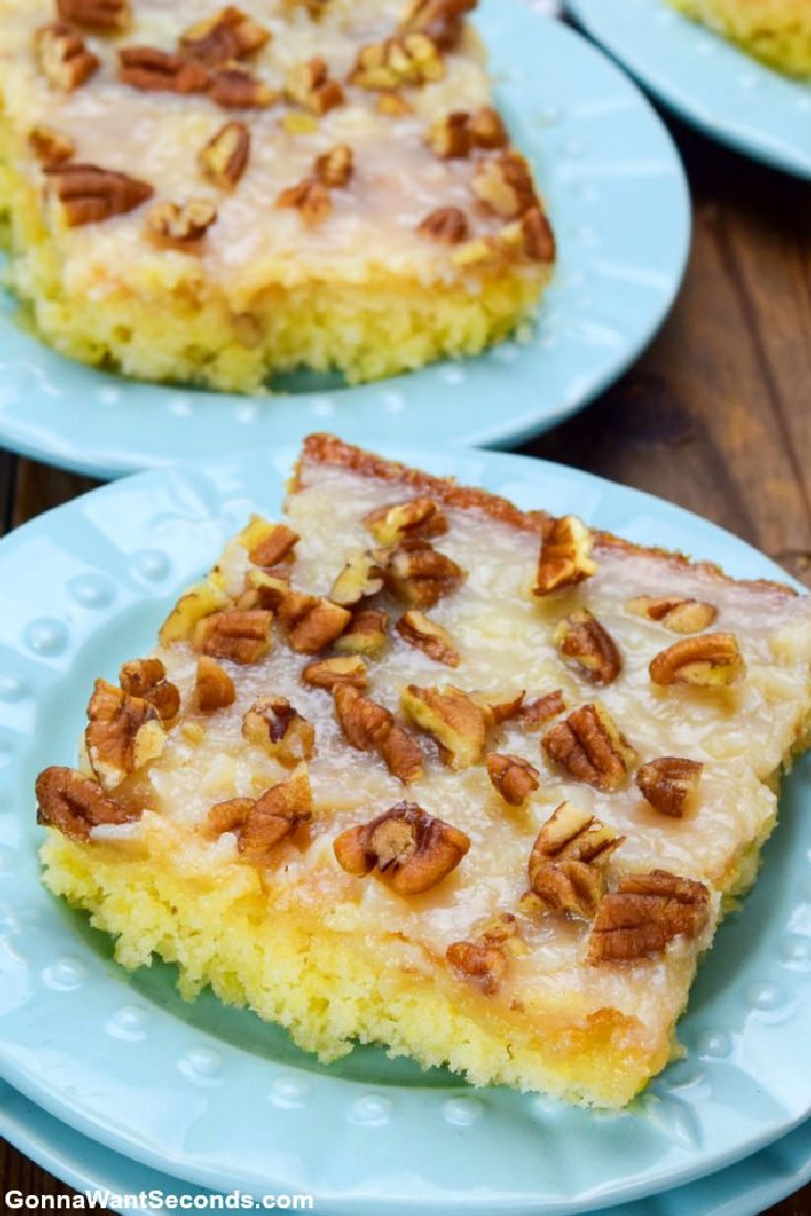 a slice of pineapple sheet cake with coconut pecan frosting