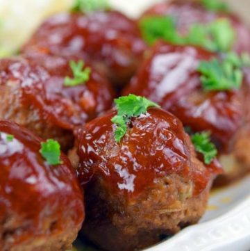 BBQ Meatballs with sauce on top, on a plate