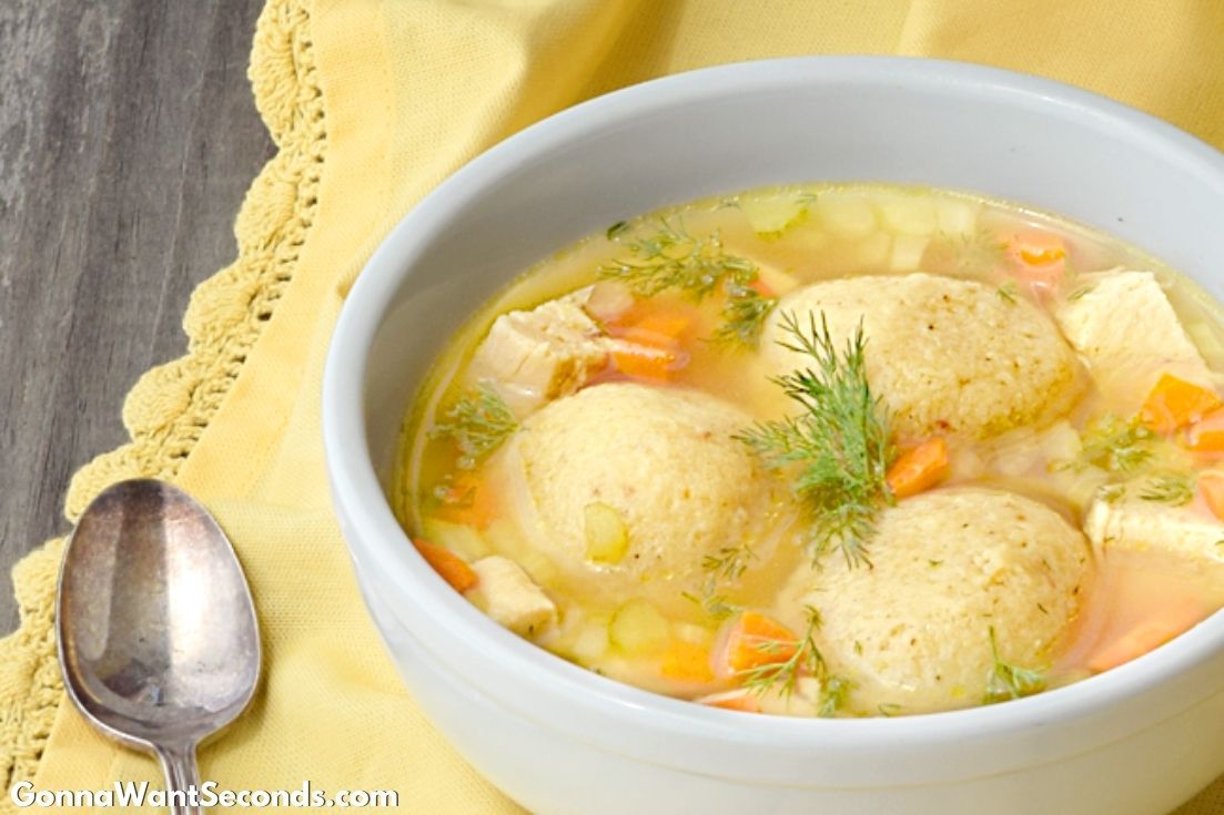 This extensive list of chicken soup recipes offers a variety of scrumptious flavors and textures to ensure you’ll never need to buy canned again. #ChickenSoups #Soups #ChickenRecipe Matzo Ball Soup in a bowl