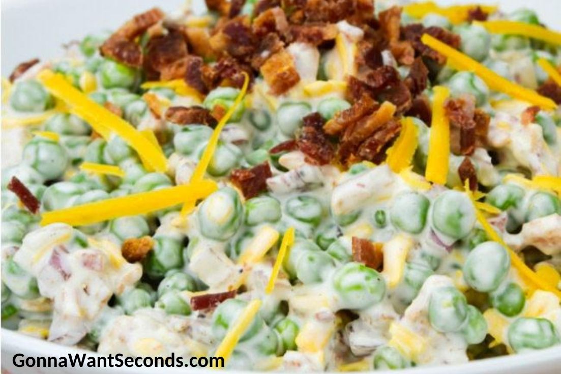 Pea Salad topped with bacon bits and shredded cheese