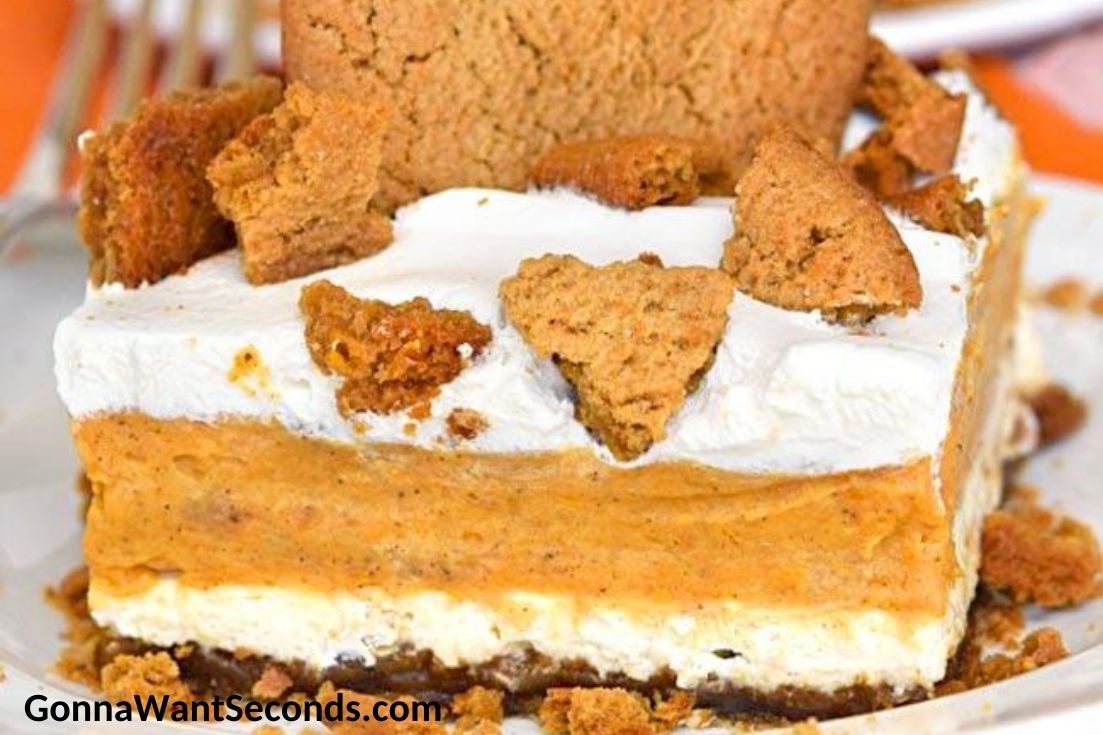 A slice of pumpkin lasagna topped with crushed ginger snaps