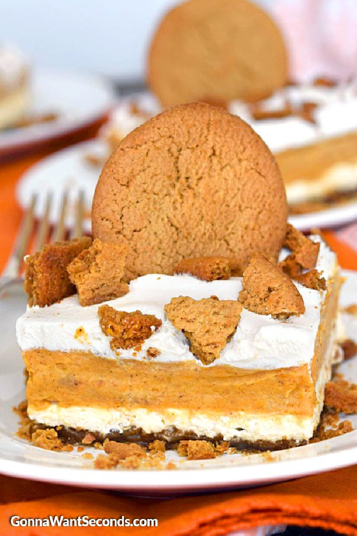 A slice of pumpkin lasagna topped with crushed ginger snaps
