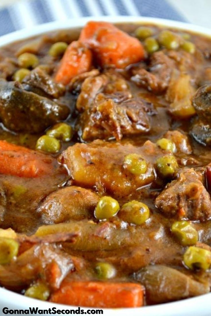 slow cooker beef stew with mushrooms in a bowl