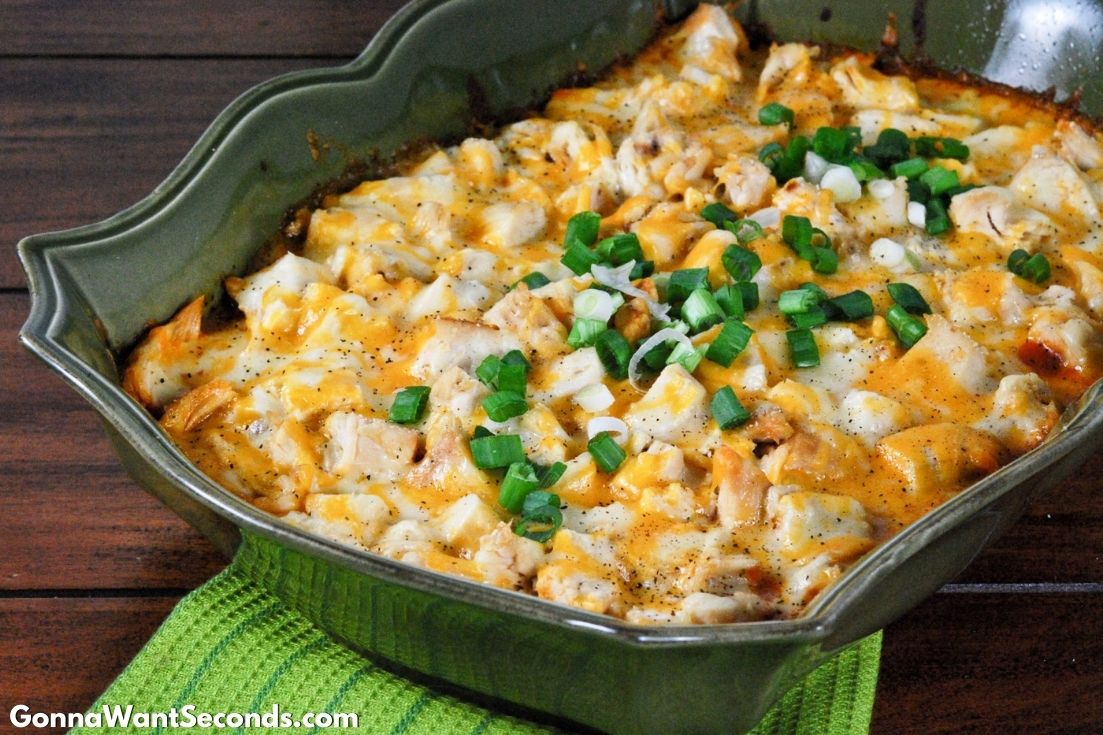 chicken tamale casserole with jiffy mix in a green casserole dish