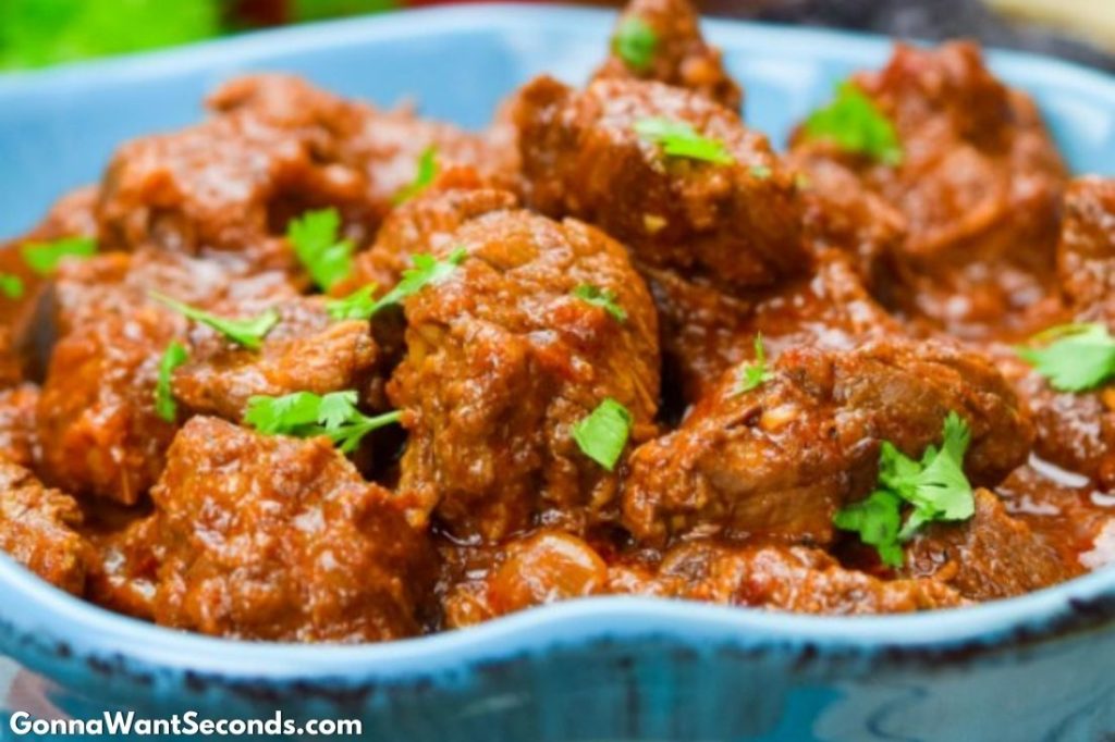 Carne guisada in a blue bowl