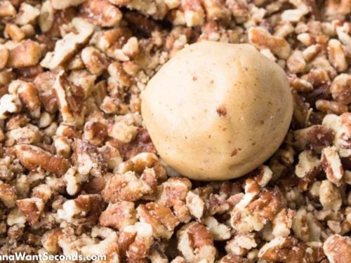 How to make Butter Pecan Cookies, rolling the cookie dough on pecans