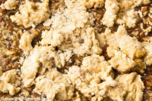 How to make Pecan Pie Cobbler, dropping the topping mixture over pecan mixture